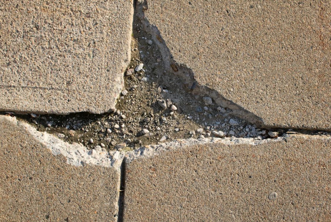 Cracked concrete pavement.